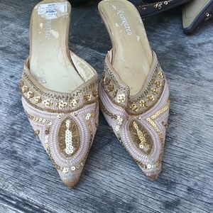 Restricted gold shoes